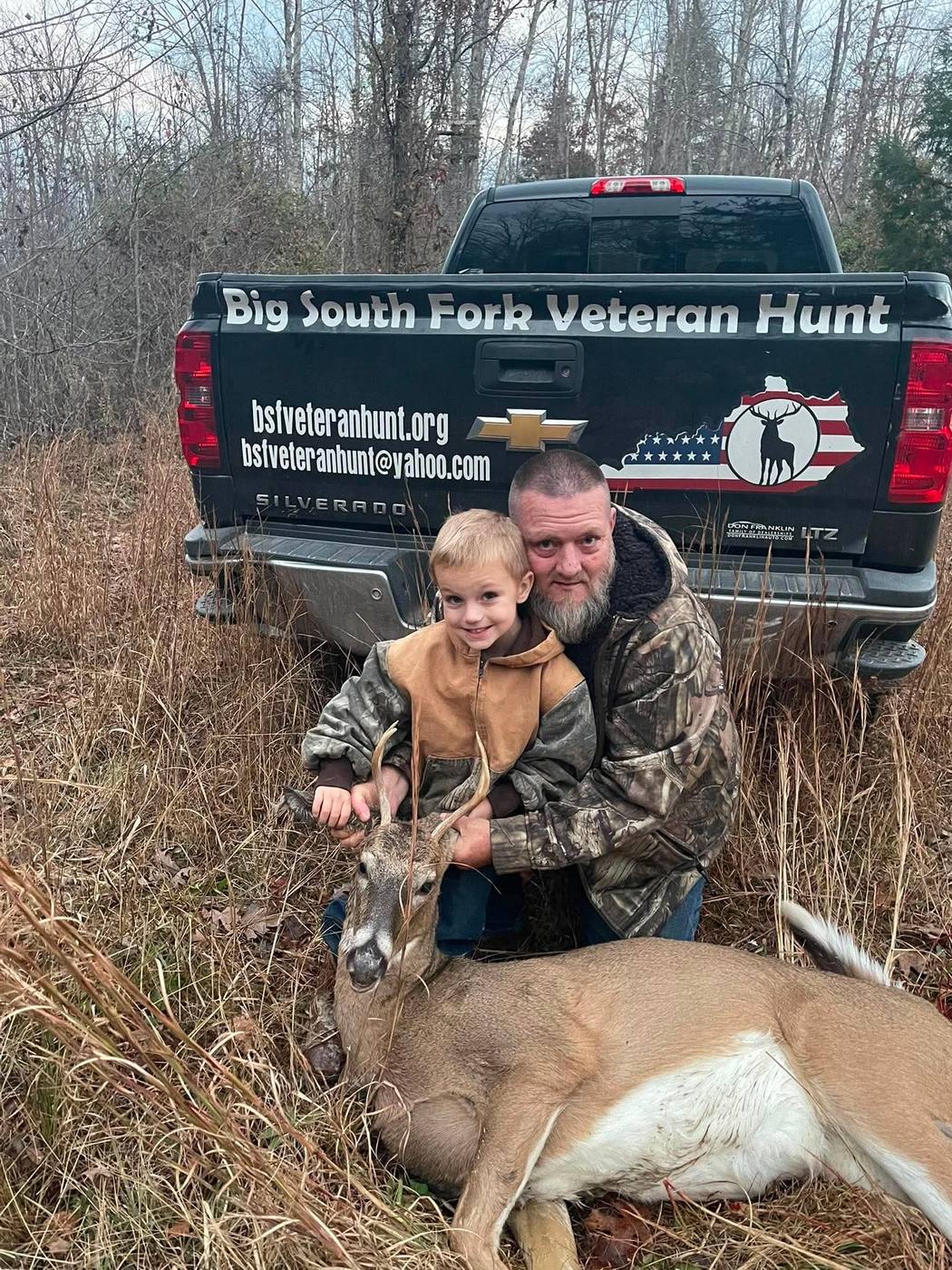 A veteran and his son with a whitetail buck taken on a Big South Fork guided hunt.